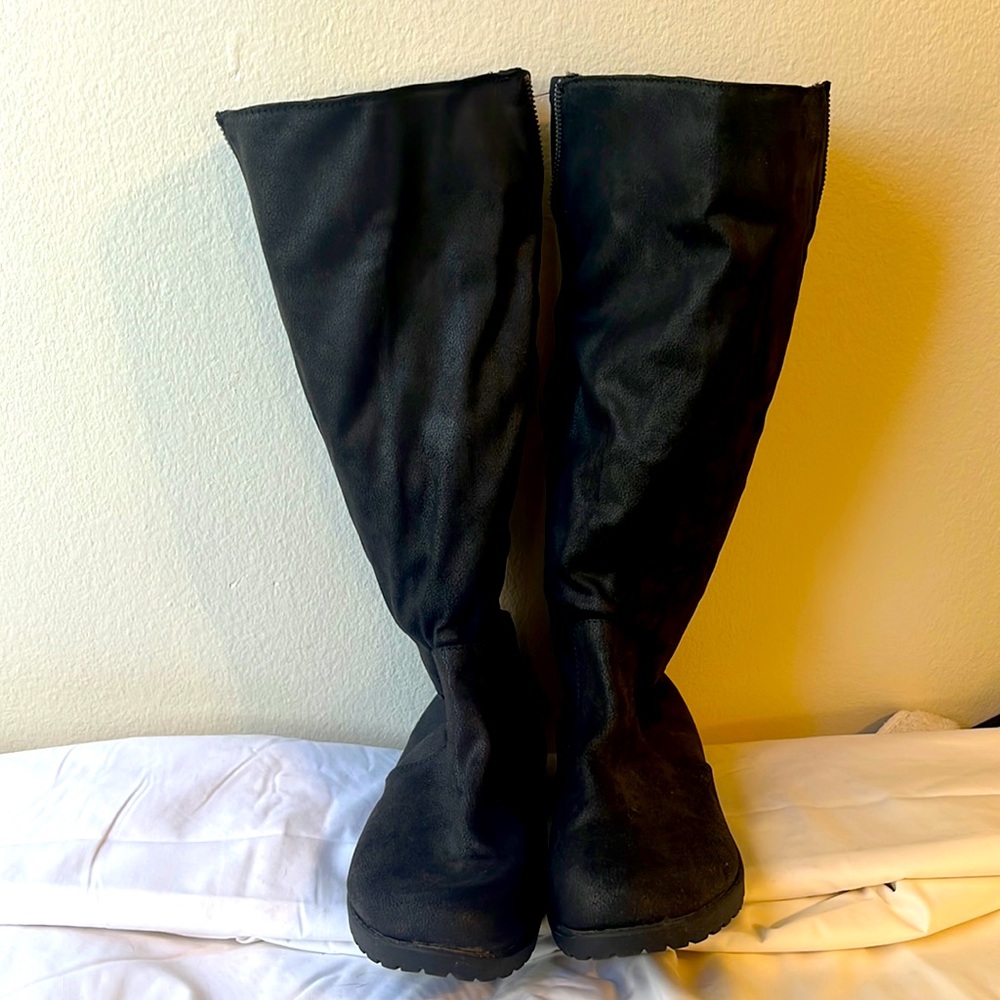 Black tall boots with zipper and buckle details